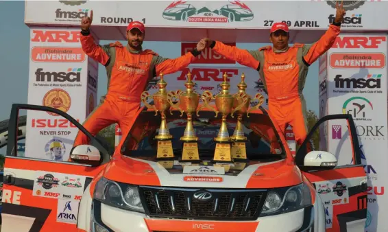  ??  ?? Team Mahindra Adventure’s Gaurav Gill ( left) and his navigator Musa Sherif pose with the trophies.