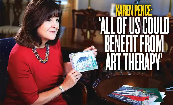  ?? | MANUEL BALCE CENETA/ AP PHOTO ?? Karen Pence, wife of Vice President Mike Pence, shows a box of greeting cards designed from her artwork, during an interview with the Associated Press in her office at the Eisenhower Executive Office Building on the White House complex inWashingt­on, on...