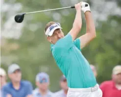  ?? —AFP ?? IRVING: Ian Poulter of England hits a shot on the 18th tee during Round One of the AT&T Byron Nelson at the TPC Four Seasons Resort Las Colinas in Irving, Texas.