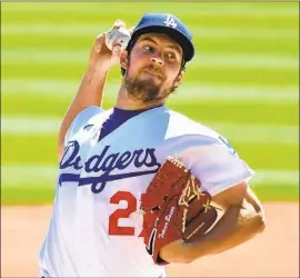  ?? Wally Skalij Los Angeles Times ?? NEW DODGERS pitcher Trevor Bauer has a big personalit­y but hasn’t clashed with the rest of the clubhouse. “He’s been one of the guys,” David Price said.