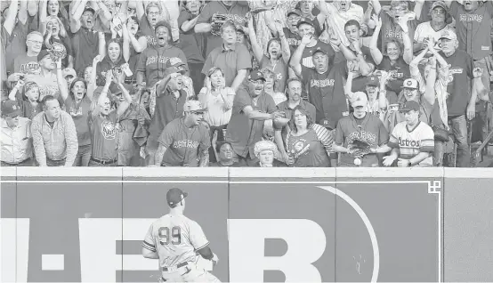  ?? Brett Coomer / Houston Chronicle ?? Astros fans jumped to their feet when catcher Brian McCann’s ground rule double scored third baseman Alex Bregman during a pivotal three-run fifth inning.