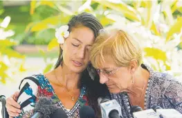  ?? Craig T. Kojima, Honolulu Star-Advertiser ?? Rescued hiker Amanda Eller, left, is embraced by her mother, Julia Eller, at Maui Memorial Hospital in Wailuku, Hawaii, in May.