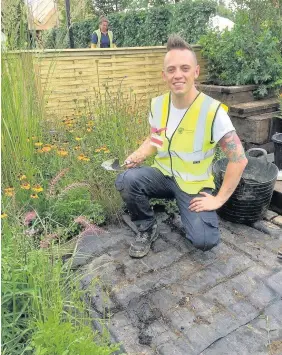  ?? Ormskirk based garden designer Lee Burkhill, the Garden Ninja was named as a finalist at the gardening ‘Oscars’. Lee was a finalist in the ‘Alan Titchmarsh New Talent’ category at the Garden Media Guild Awards, where he was recognised for his garden desig ??