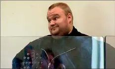  ??  ?? Accused: Kim Dotcom at his bail hearing on January 25. The judge denied him bail, saying Dotcom's vast wealth meant he could flee the country if released from custody