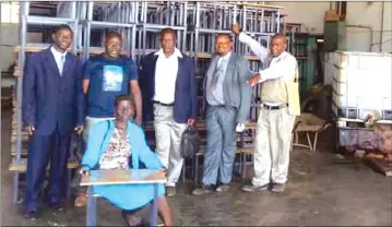  ??  ?? Chipinge RDC officials showcase part of the furniture donated to 10 rural schools in the district.
