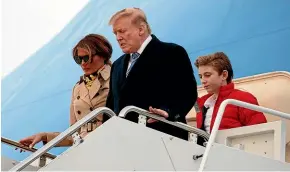  ?? AP ?? President Donald Trump, first lady Melania Trump and their son Barron Trump arrive on Air Force One at Andrews Air Force Base, Maryland as they return from Palm Beach, Florida.