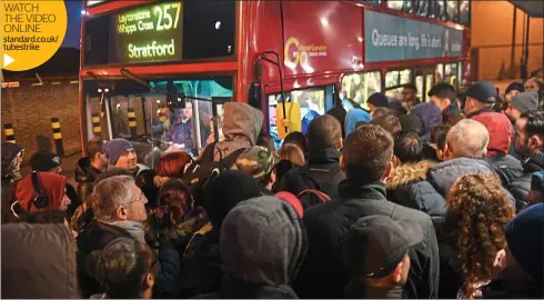  ??  ?? WATCH THE VIDEO ONLINE standard.co.uk/ tubestrike Tube strike woe: commuters queue to board an already packed bus outside Leytonston­e station before a limited Central line service began running today Editorial Comment
