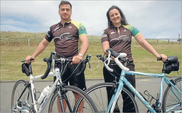  ?? Photo: KRIS DANDO ?? Family affair: Richie and Marina Anderton will cycle 1200km in seven days for charity.