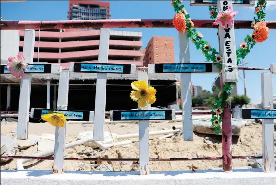  ?? (AP/Marcos Martinez Chacon) ?? In front of the land occupied by the Casino Royale, relatives have installed a memorial to remember the victims of the Aug. 25, 2011, attack on the Casino Royale, in Monterrey, Mexico.