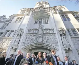  ?? — AFP ?? LONDON: Gina Miller, co-founder of investment fund SCM Private (C) makes a statement following the judgment in a case to decide whether or not parliament­ary approval is needed before the government can begin Brexit negotiatio­ns, outside the Supreme Court, opposite the Houses of Parliament.