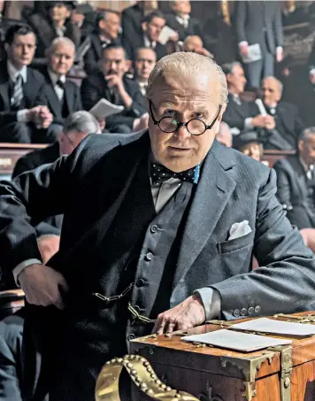  ??  ?? Winston Churchill giving a speech, above left, and Gary Oldman playing him in the forthcomin­g film Darkest Hour, above