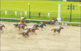  ?? Associated Press ?? In this image taken from video provided by NBC Sports, Secretaria­t, right, crosses the finish line to win a computer-simulated version of the Kentucky Derby.