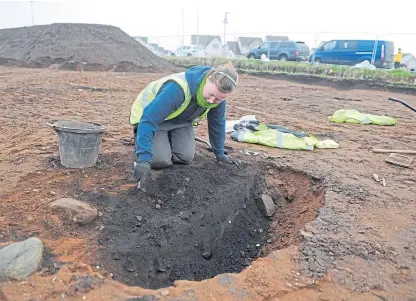  ?? Picture: Kim Cessford. ?? One of the archaeolog­ical team at work on Balmachie Road, Carnoustie. The site has been found to contain two Neolithic halls, one of which is the largest ever found in Scotland.