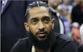  ?? ?? Rapper Nipsey Hussle attends an NBA game between the Golden State Warriors and the Milwaukee Bucks in Oakland, Calif., on March 29, 2018.