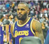  ?? CARLOS OSORIO ASSOCIATED PRESS ?? Lakers forward LeBron James is ejected after fouling Pistons center Isaiah Stewart during Sunday’s game in Detroit.