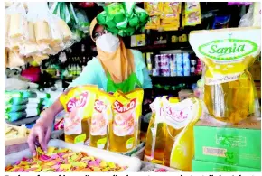  ?? ?? Packs of cooking oil on display at a market stall in Jakarta, Indonesia.