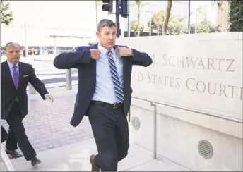  ?? Sandy Huffaker / Getty Image ?? Rep. Duncan Hunter, R-Calif., walks into the federal courthouse for an arraignmen­t hearing on Wednesday in San Diego, Calif. Hunter and his wife, Margaret, are accused of using more than $250,000 in campaign funds for personal use.