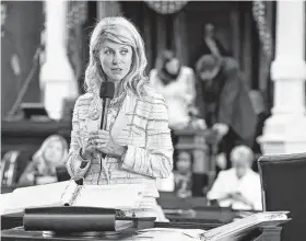  ?? Tom Reel / Staff file photo ?? Then-Sen. Wendy Davis, D-Fort Worth, uses the filibuster in an effort to cause abortion legislatio­n to die without a vote on the floor on June 25, 2013.