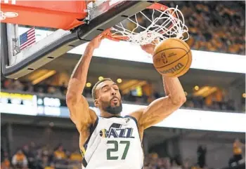  ?? RICK BOWMER AP ?? Jazz center Rudy Gobert, who had 17 points and 15 rebounds, dunks against Dallas in the second half.