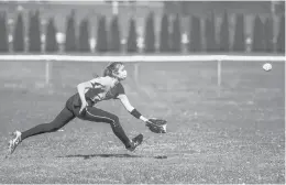  ?? KASSI JACKSON/HARTFORD COURANT ?? A player goes for a catch as the Southingto­n Blue Knights softball team takes to the field Saturday on the first day of spring sports practice.