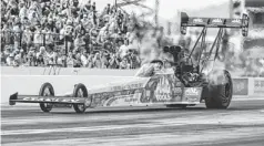  ?? STACIE SCOTT/AZCENTRAL SPORTS ?? Top Fuel driver Doug Kalitta makes a qualifying run for the Carquest Auto Parts NHRA Nationals at Wild Horse Pass Motorsport­s Park in Chandler on Saturday. Kalitta is the top seed heading into today’s finals.