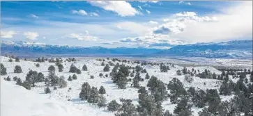  ?? Brian van der Brug Los Angeles Times ?? RECENT STORMS have dumped record levels of snow in the Sierra Nevada, helping ease the drought. But melting snowpack and heavy rains have also sparked alarm about f looding in the Owens Valley, above.