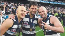  ??  ?? Gary Ablett (left) with Cats Jimmy Bartel (centre) and Paul Chapman following the club’s 2009 flag.
