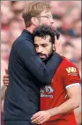  ?? REUTERS ?? Mohamed Salah is embraced by Liverpool manager Jurgen Klopp after Saturday’s 0-0 Premier League draw with Manchester United.