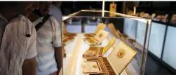  ??  ?? CUBAN BEAUTS: Visitors from Brazil look at cigars on display at the XVIII Habanos Festival.