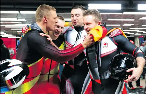  ?? JEAN LEVAC/POSTMEDIA NETWORK ?? From left: Germany’s Thorsten Margis and Francesco Friedrich and Canada’s Alexander Kopacz and Justin Kripps celebrate winning the gold medal in the men’s two-man bobsleigh at the Olympic Sliding Centre yesterday.