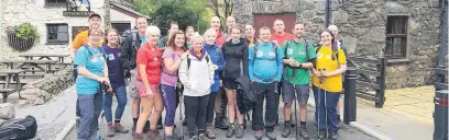  ??  ?? ●●Stockport Homes Group staff preparing to trek up Scafell Pike