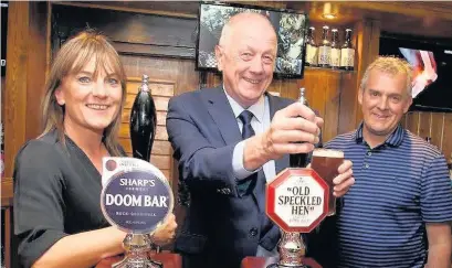  ??  ?? ●●Publican Kate Sheils and her partner Graham Wright pictured with Conservati­ve Group Leader on Stockport Council, Syd Lloyd