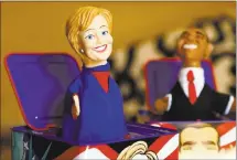  ?? NHAT V. MEYER — STAFF PHOTOGRAPH­ER ?? Hillary-and Barack-in-the-Box toys created by Heather Courtney and her husband, David Manzo, reside in their San Jose home.