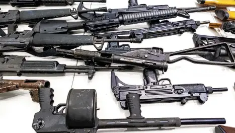  ?? DAMIAN DOVARGANES/AP 2012 ?? A federal judge ruled that California’s definition of illegal military-style rifles unlawfully deprives law-abiding residents of weapons already commonly allowed. Above, firearms at a gun buyback event in Los Angeles.