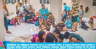  ??  ?? BORONGAN, the Philippine­s: Residents rest in an evacuation centre, as typhoon Phanfone makes landfall, in Borongan, Eastern Samar province, central Philippine­s yesterday. Typhoon Phanfone smashed into the central Philippine­s leaving thousands of people unable to get home for the Christmas holidays and forcing many others to evacuate in the face of the onslaught. — AFP