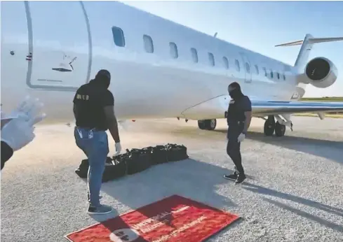  ?? DNCD ?? Video released by the Dominican Republic authoritie­s shows law enforcemen­t officers going through what is allegedly the cocaine seized on a Canadian chartered airliner in April. The Canadian flight crew were detained for months despite video evidence showing they were not involved.