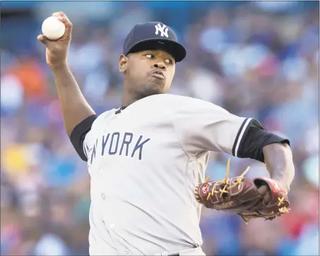  ?? Fred Thornhill / Associated Press ?? Luis Severino picked up his 14th win of the season with a victory over the Blue Jays on Saturday.