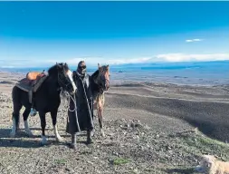  ??  ?? Below: Bundled up against the cold and wind, Masetti Leite rides on the road from El Calafate to La Esperanza in Argentina in 2017.