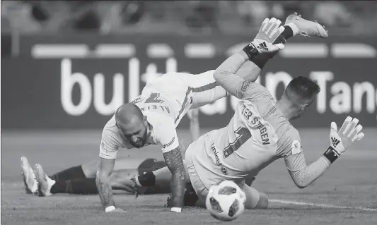  ??  ?? Barcelona goalkeeper Marc-Andre ter Stegen (right) concedes a penalty against Sevilla’s Aleix Vidal during the Spanish Super Cup final on Sunday in Tangier, Morocco.