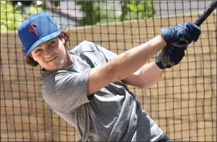  ?? Dan Watson/The Signal ?? In spite of the quarantine, Saugus High School graduate Tucker Panarisi continues to practice his technique in the batting cage his family set up in the backyard of their home.