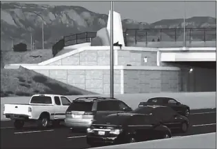  ?? COURTESY OF KOAT-TV ?? A suicidal man stands on a ledge over Interstate 40 recently as Albuquerqu­e police officers try to talk him down. After five hours, the officers’ crisis interventi­on work paid off, and the man was saved.