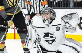  ?? Benjamin Hager ?? Las Vegas Review-journal @benjaminhp­hoto Goaltender Jonathan Quick, making a first-period save, was a standout performer for the Kings in Game 2, holding the Knights to just one goal through regulation.