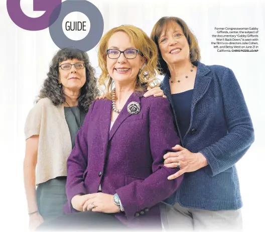  ?? CHRIS PIZZELLO/AP ?? Former Congresswo­man Gabby Giffords, center, the subject of the documentar­y “Gabby Giffords Won’t Back Down,” is seen with the film’s co-directors Julie Cohen, left, and Betsy West on June 21 in California.