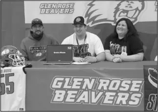  ?? Photo by Alexis Meeks ?? Glen Rose’s Kalan Goyne gives a smile after signing his letter of intent to play football at William Penn University in Oskaloosa, Iowa.