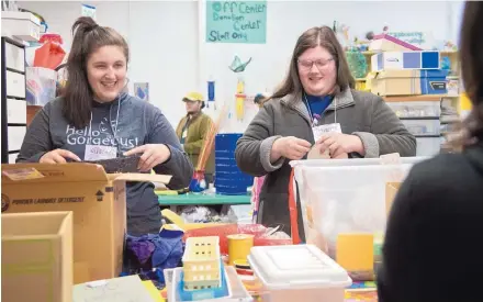  ?? MARLA BROSE/JOURNAL ?? Lindsey Fulmer, 25, left, and her sister Lee Ellen Fulmer, 23, sort through boxes of art supplies at the OFFCenter Community Arts Project. The sisters are traveling around the country volunteeri­ng in every state. New Mexico is the 30th state they have...