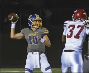  ?? The Sentinel-Record/Grace Brown ?? LOOKING DOWNFIELD: Lakeside senior quarterbac­k Will Ross (10) looks to pass during an Oct. 9 game against Texarkana at Chick Austin Field. The Rams travel to Hope tonight.