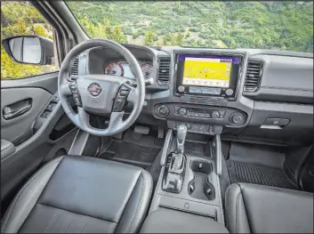  ?? ?? New trim, finishes and meter accents are inspired by adventure gear for the 2022 Nissan Frontier. There is 4 liters of storage in the center console.