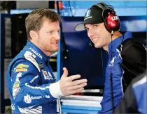  ?? AP PHOTO BY CHUCK BURTON ?? In this May 27, file photo, Dale Earnhardt Jr., left, talks with crew chief Greg Ives during practice for a NASCAR Cup series auto race at Charlotte Motor Speedway in Concord, N.C. Before Dale Eanrhardt Jr. calls it a career and starts calling races...