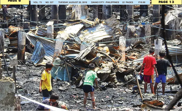  ?? BING GONZALES ?? DAYS after the Friday fire that damaged 150 houses, children look for valuables and other materials that they can still use or sell at the site in Isla Verde, Barangay 23-C. Poblacion DIstrict.