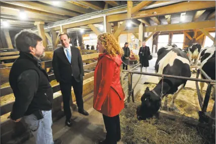  ?? Ben Lambert / Hearst Connecticu­t Media ?? Sen. Chris Murphy, center, and Rep. Elizabeth Esty, both D-Conn., speak with Clint Thorn, owner of Thorncrest Farm & Milk House Chocolates in Goshen.